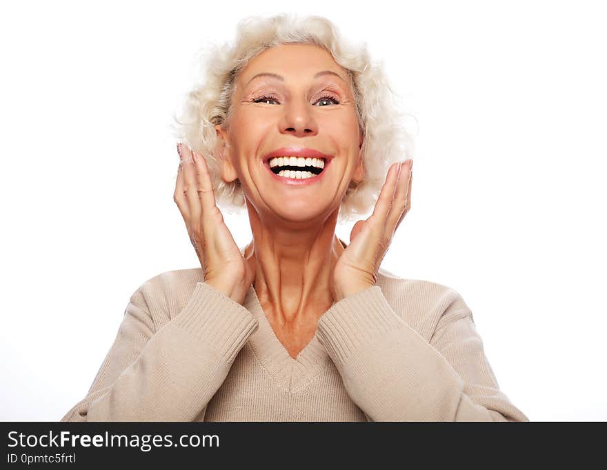 Lifestyle, emotion  and people concept: Grey haired old nice beautiful laughing woman. Isolated over vwhite  background