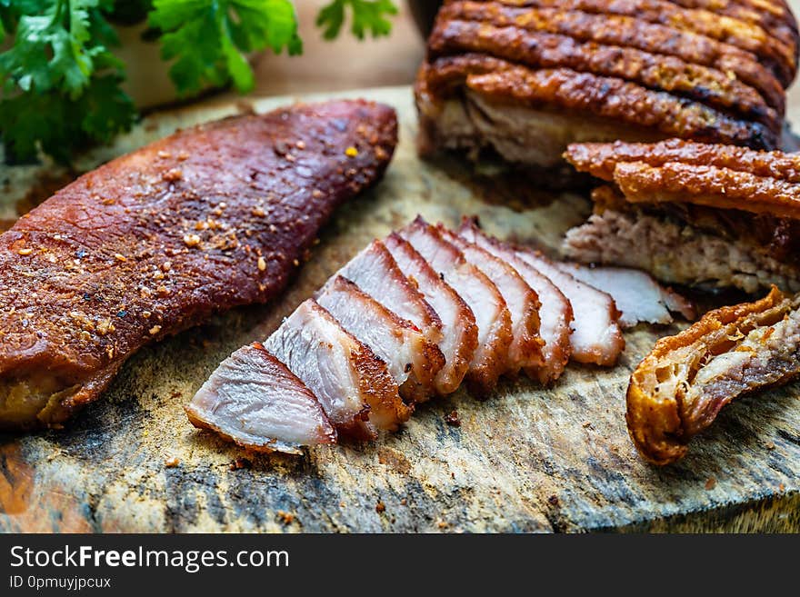 Close up of roast pork on wooden cutting board