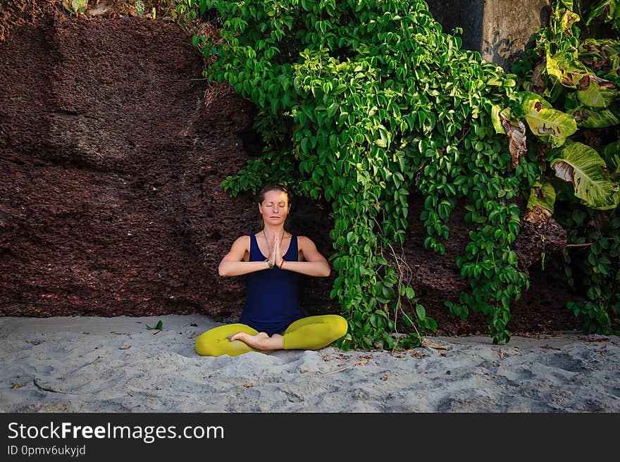 Portrait of happiness young woman practicing yoga on outdoors.Yoga and relax concept. Beautiful girl practice asana