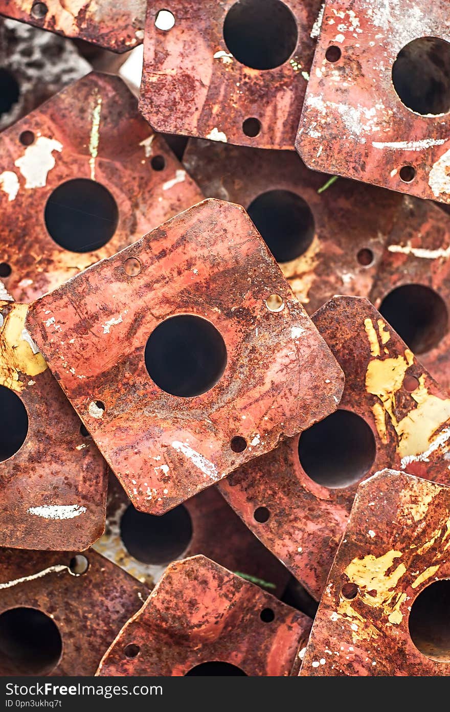 Pile of scrap rusty grunge metal plates covered in rust. Close up