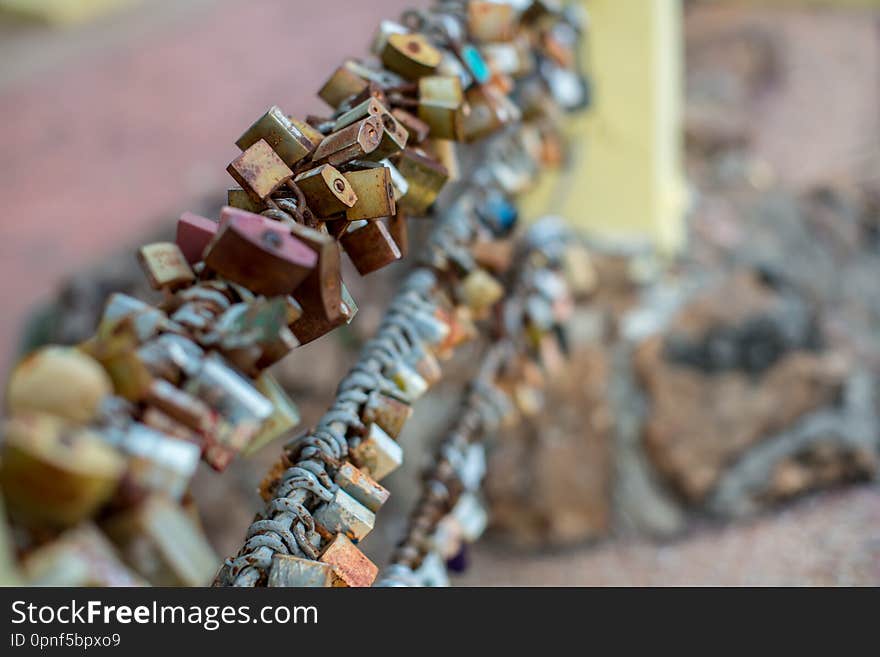 Lock for couple make a promise to love forever, master keys hanging on the rails of bridge, the sign of love and romantic affection as a landmark. Symbolic love locks hang along.