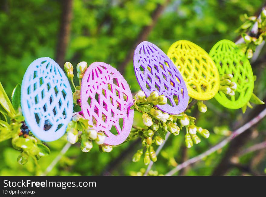 Easter eggs made of colored felt with flowering branches of fruit tree. Postcard, banner for Easter