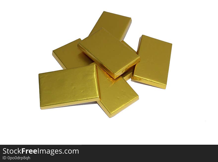 Fresh chocolate gold bars in white bg