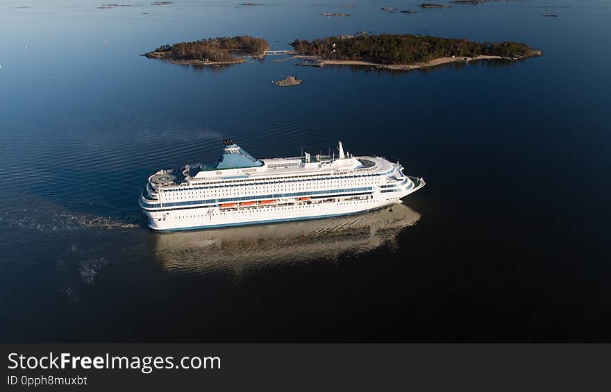 Aerial view of cruise liner sailing in the open sea