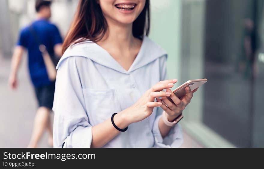 Woman using smartphone, During leisure time. The concept of using the phone is essential in everyday life.