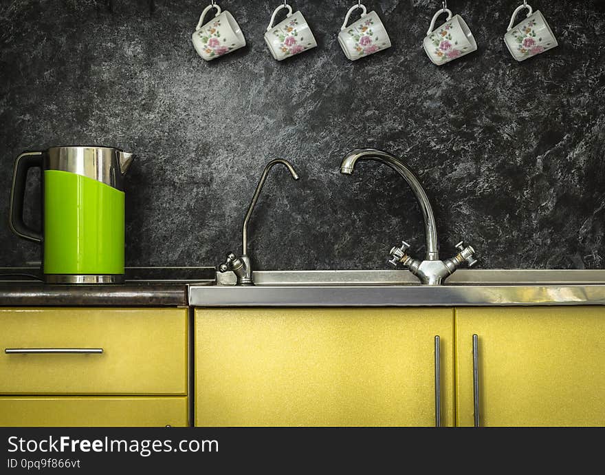 Close up to a stainless steel kitchen sink. Close up to a stainless steel kitchen sink