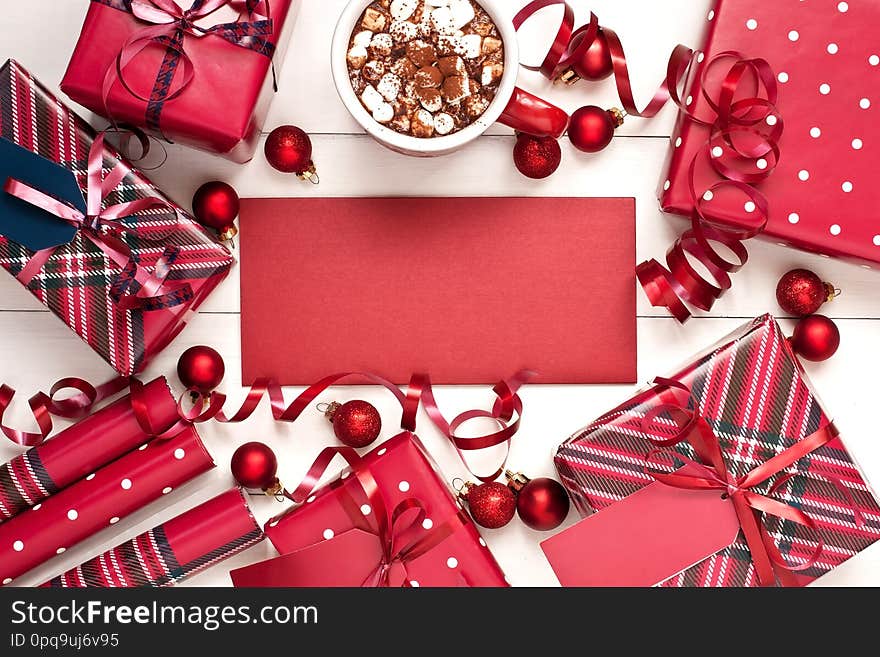 Frame with  Christmas gift boxes with  decorations on wooden  background, top view. Frame with  Christmas gift boxes with  decorations on wooden  background, top view