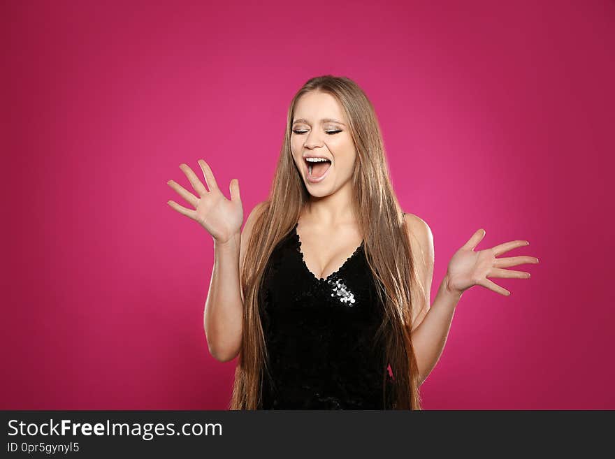 Portrait of emotional woman on colorful background