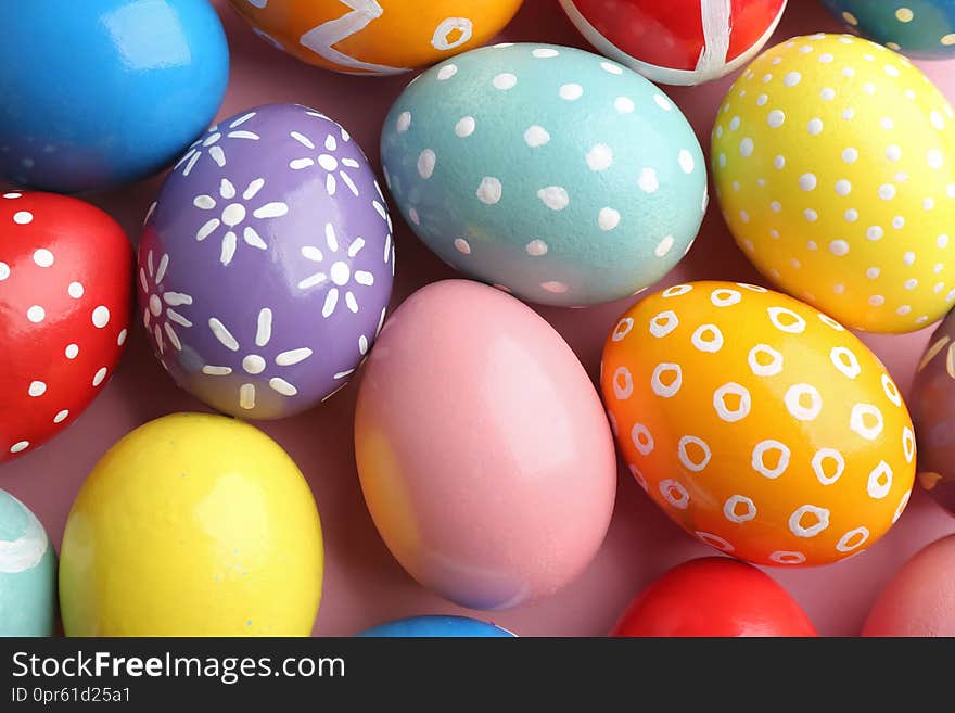 Many colorful painted Easter eggs as background, top view