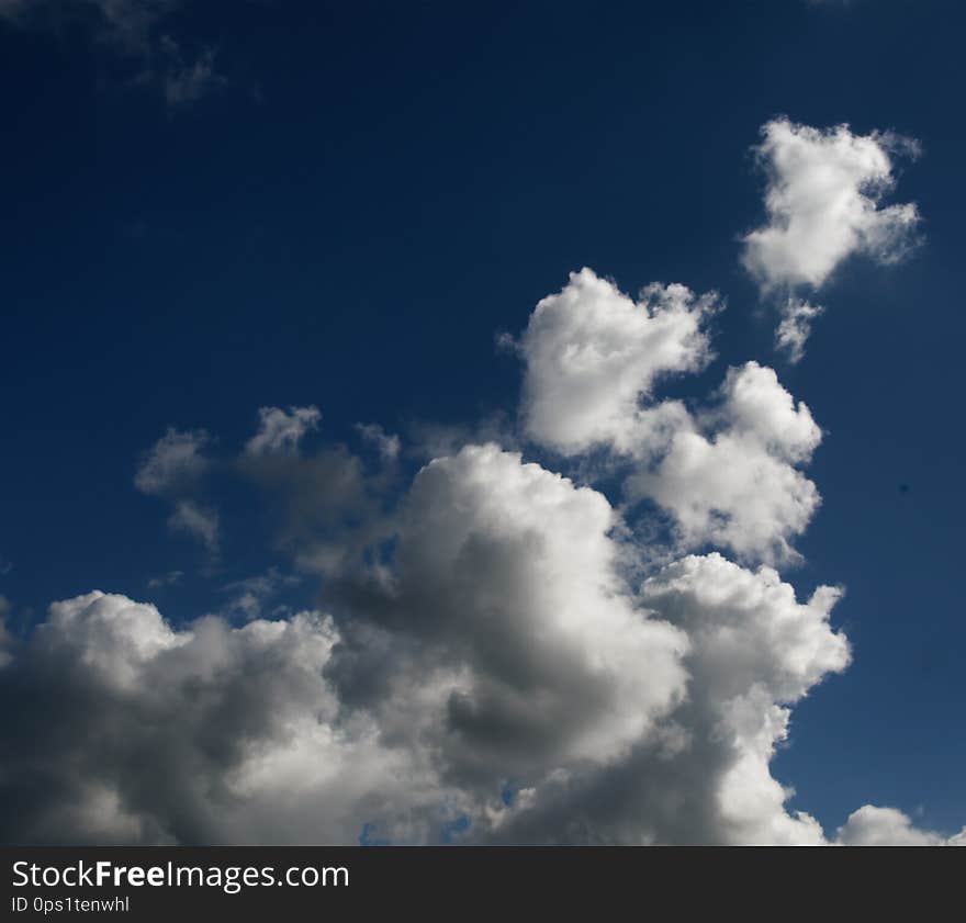 A spectacular vibrant sky cloudscape scene, with white coloured billowing cumulonimbus cloud formation in a cobalt blue sky. Atmospheric beauty in nature. New South Wales, Australia. A spectacular vibrant sky cloudscape scene, with white coloured billowing cumulonimbus cloud formation in a cobalt blue sky. Atmospheric beauty in nature. New South Wales, Australia