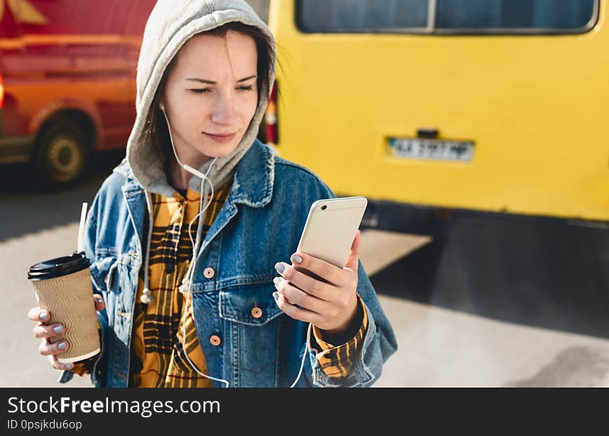 Young vlogger streaming live video live walking down a city street