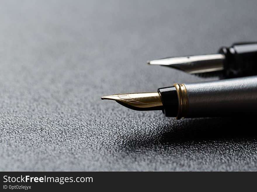 Two classics Fountain pen with clipping path on black background