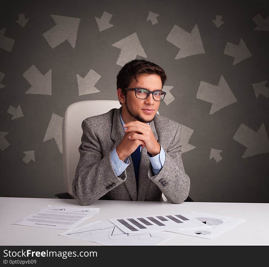 Manager In Front Of The Office Desk With Direction Concept