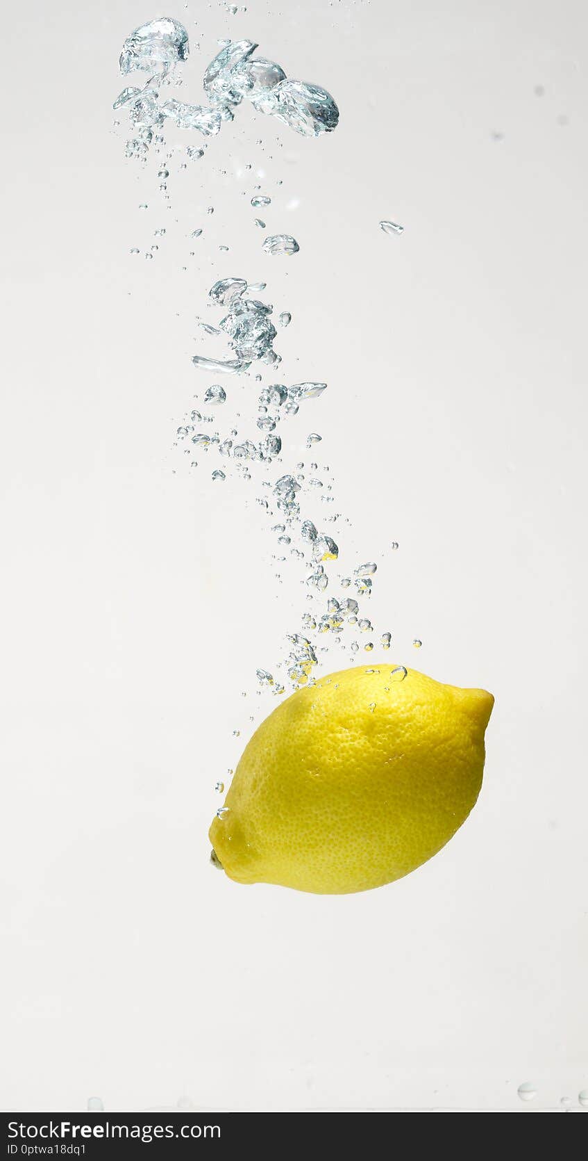 Fresh lemon drop on water with babble with white background