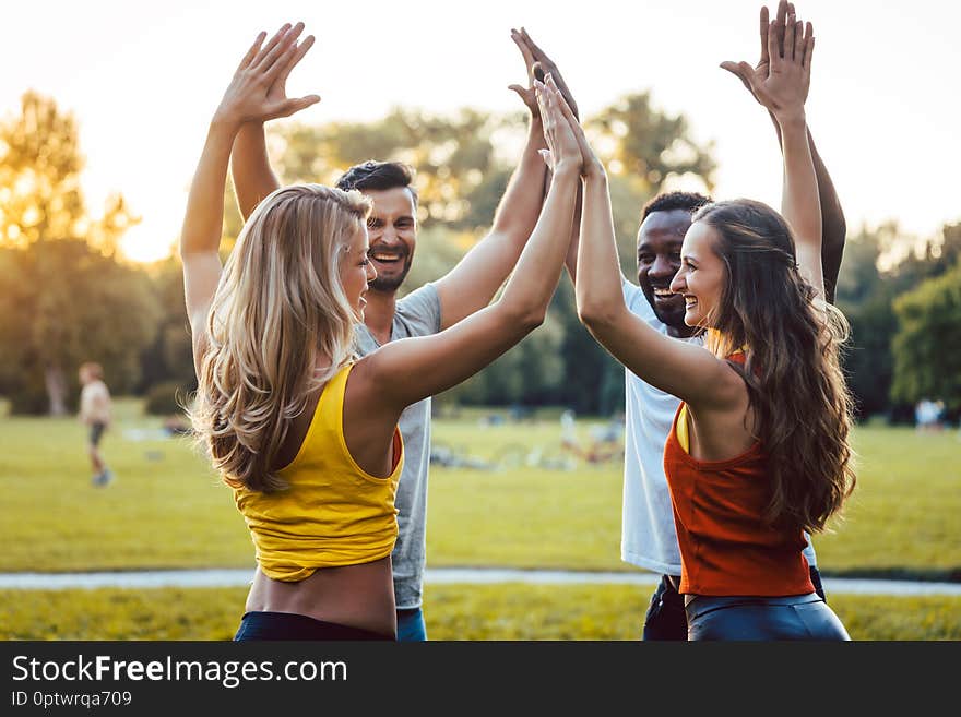 Friends having fun in the park enjoying themselves