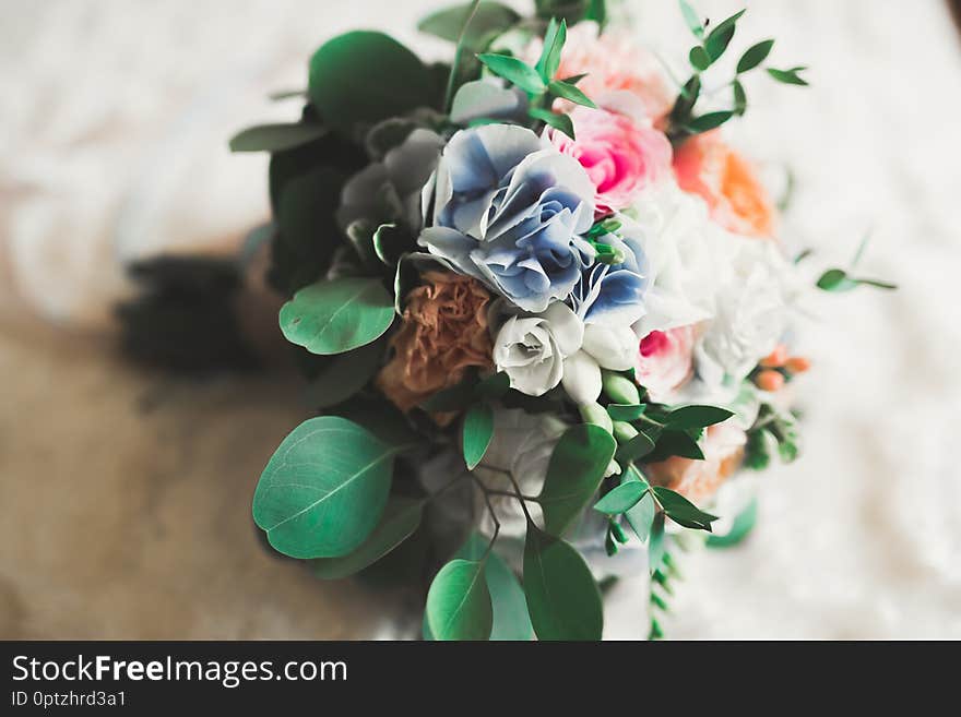 Wonderful luxury wedding bouquet of different flowers