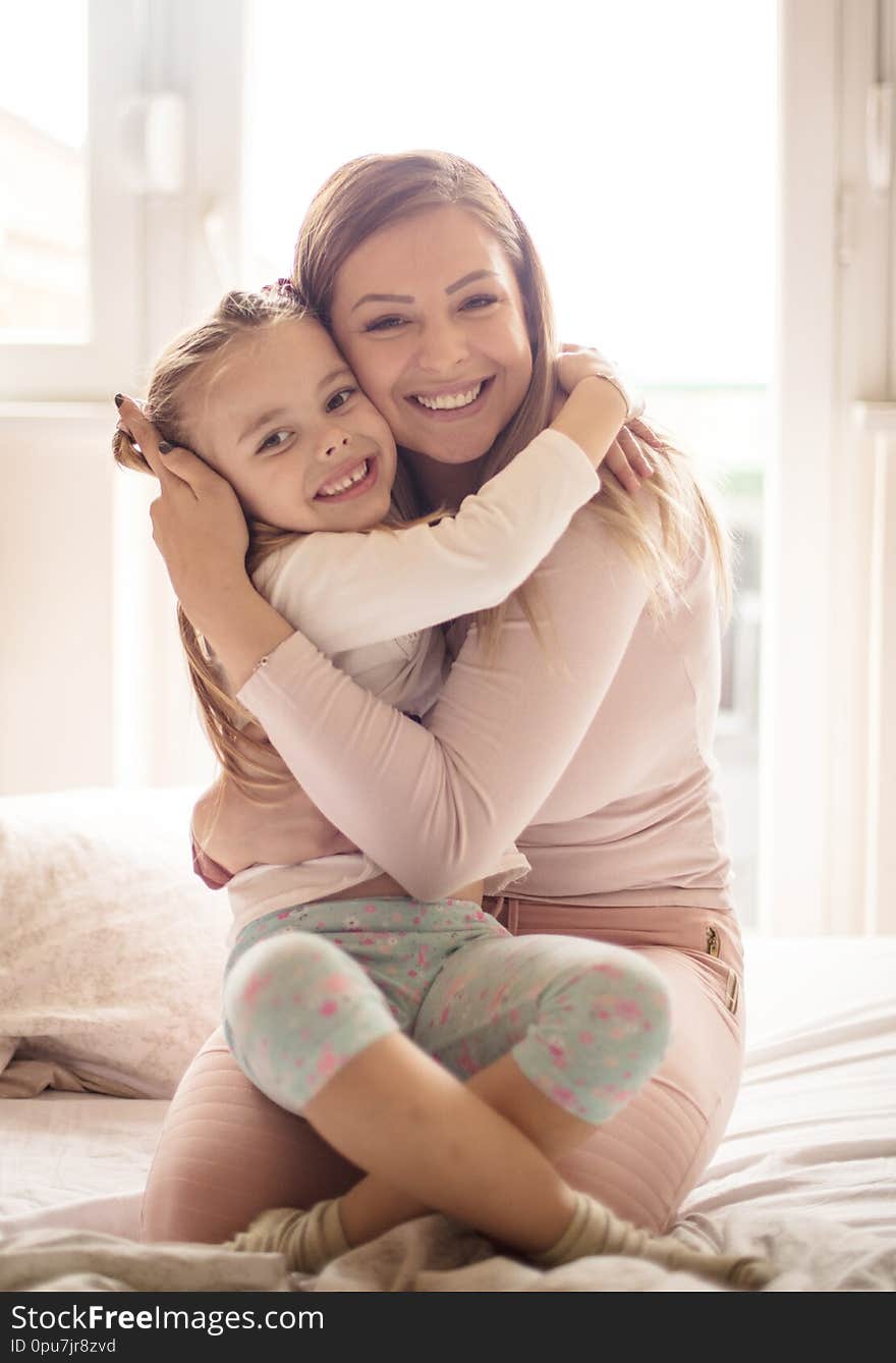 They treasure each other. Mother and daughter in bed