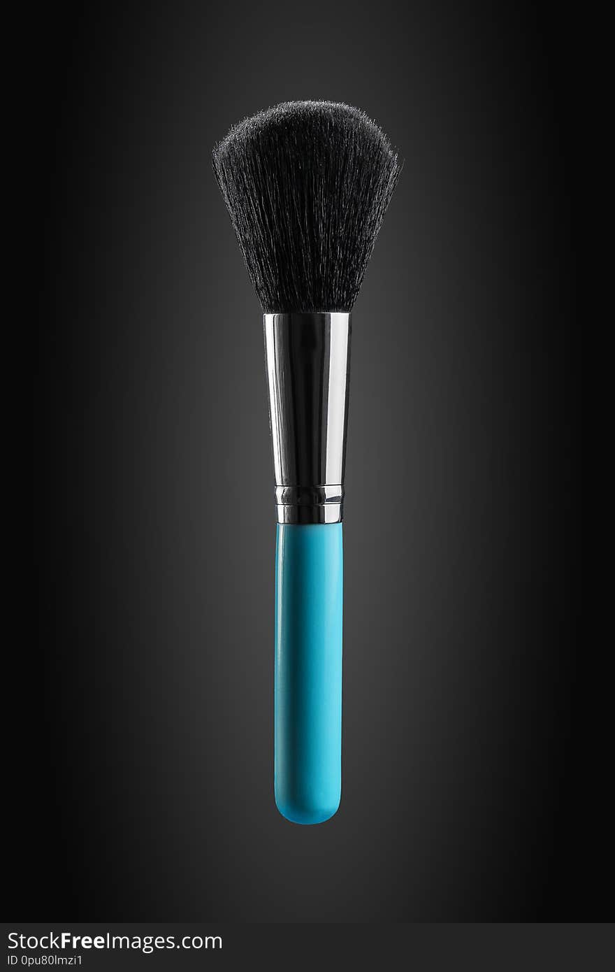 Fluffy, wide and soft powder brush new clean with blue handle promotional photo.