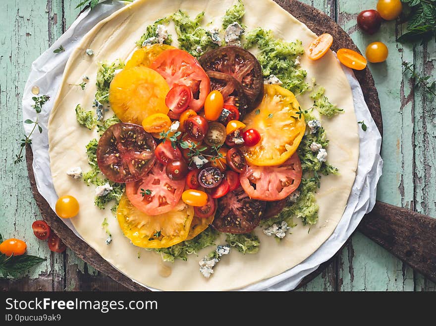 Heirloom Tomatoes Tart with Fresh Tomatoes and Cheese on wooden background