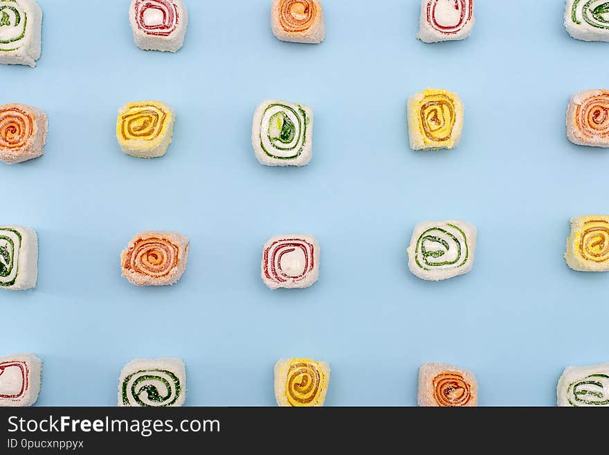 Turkish sweets of different colors on blue background