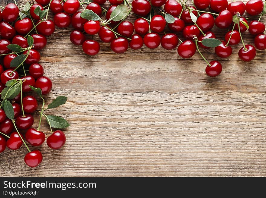 Cherries on wooden background