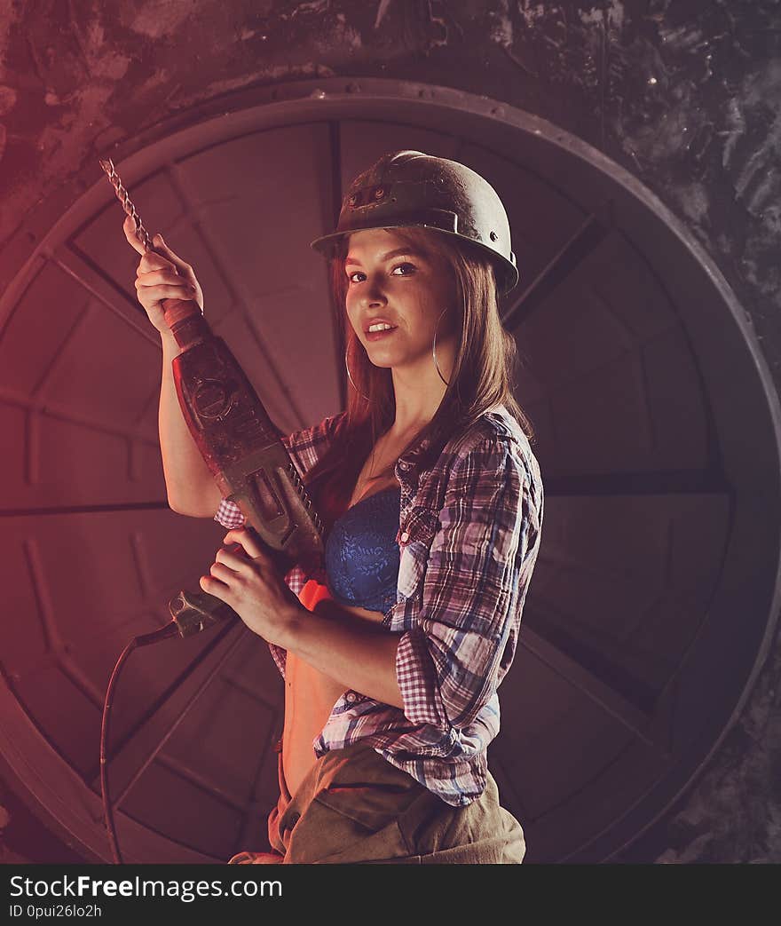 Beautiful girl in construction clothes