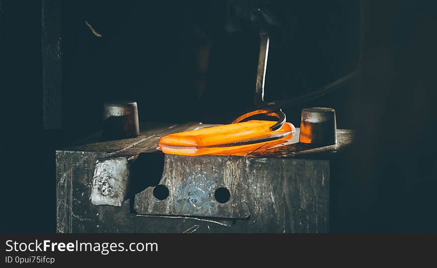The process of forging metal in the production of heavy molded metal products.