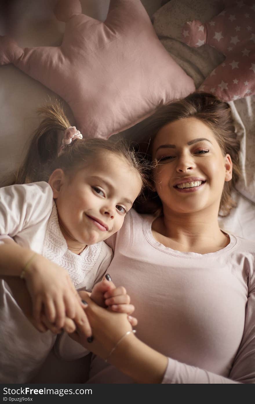 We are always together. Mother daughter in bed