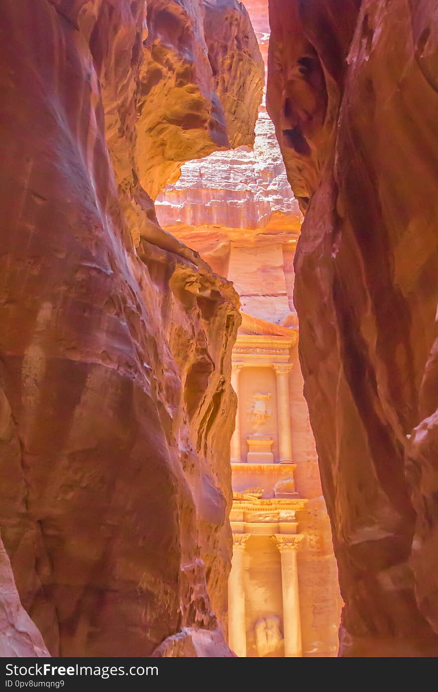 Breathtaking `Al-Khazneh` : the Treasury as it reveals in its full glory to the walkers in canyon `al-Siq`. Petra, the capital of the Nabatean Kingdom.The famous archaeological site in  southern Jordan
