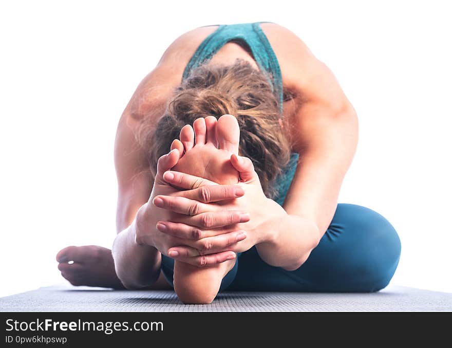 Athletic young blonde woman doing yoga practice isolated on white background.