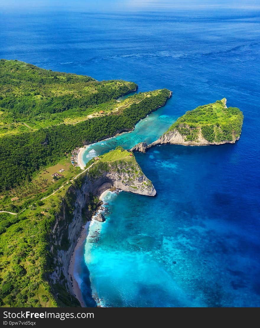 Aerial view at sea and rocks. Turquoise water background from top view. Summer seascape from air. Atuh beach, Nusa Penida, Bali, I