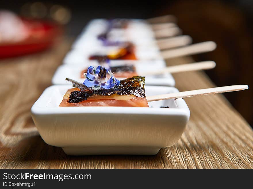 Beautifully decorated catering banquet table with snack canape in restaurant or hotel