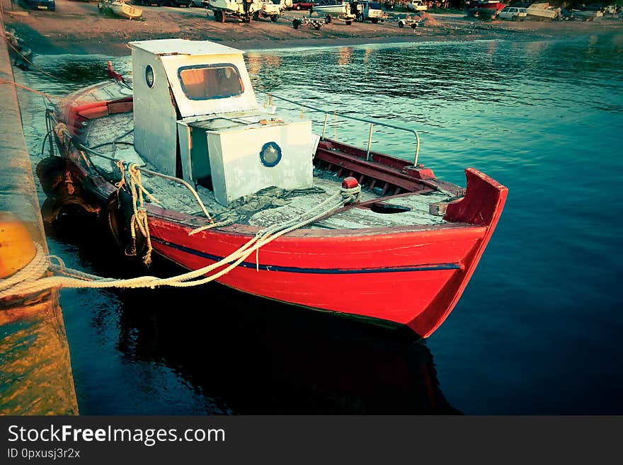 Small sea fishing boat anchored at harbor - Image. Small sea fishing boat anchored at harbor - Image