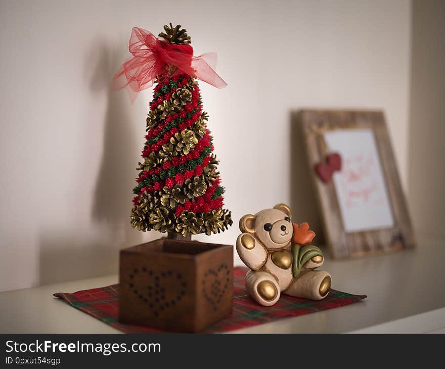 Christmas Decorations, Ornaments and Wooden Photo Frame on a Furniture in the House.