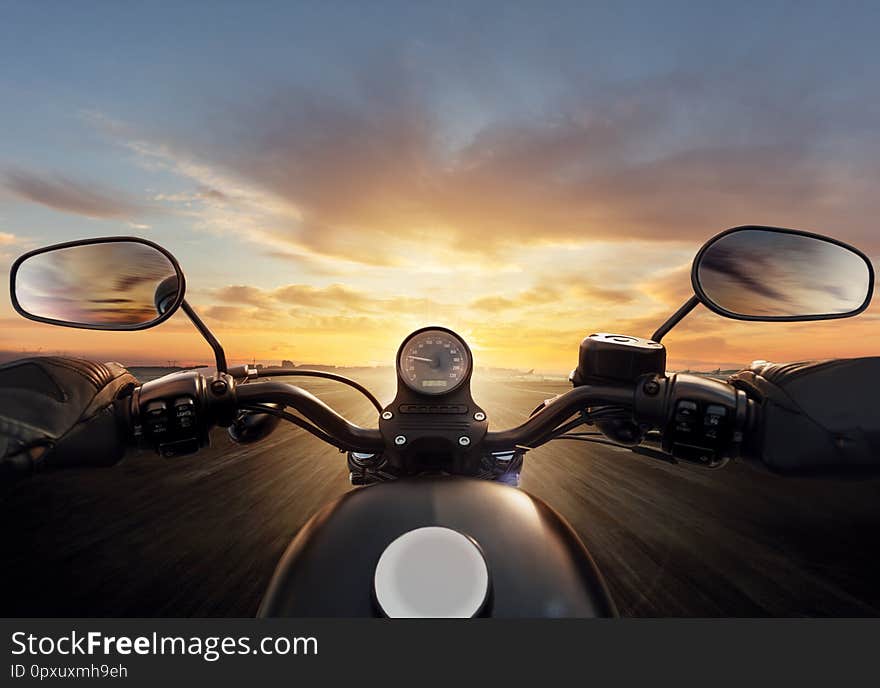 POV of motorcycle driver with handlebars