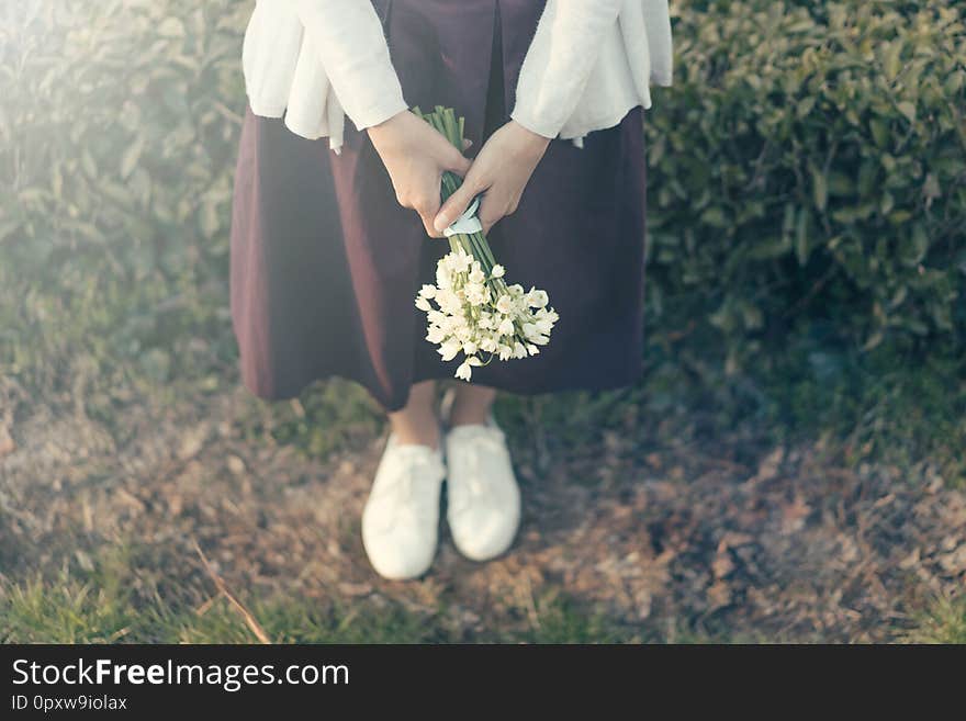 Woman and a bouquet of snowdrops