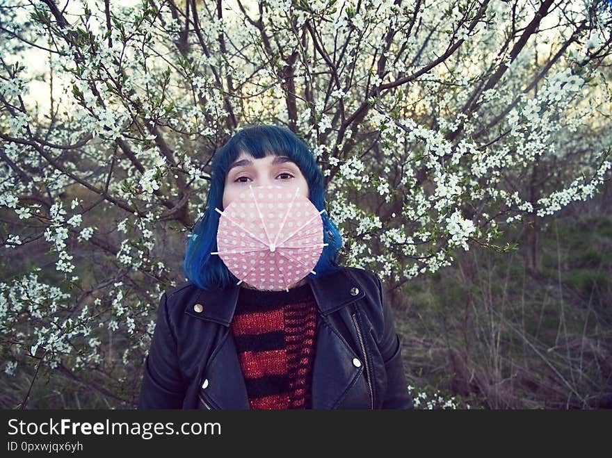 The original fashion photo of a young girl in blue hair.