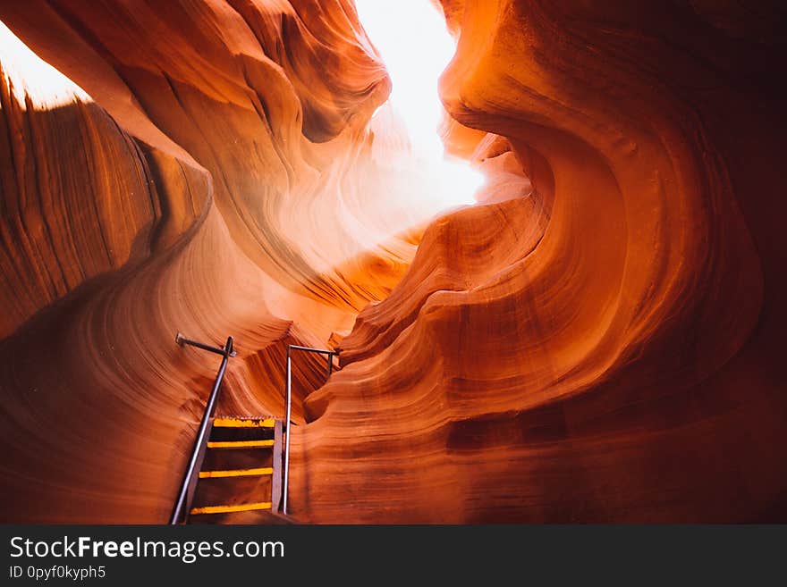 Beautiful view of amazing sandstone formations with a ladder leading toward a magic light beam in famous Antelope Canyon near the historic town of Page at Lake Powell, American Southwest, Arizona, USA. Beautiful view of amazing sandstone formations with a ladder leading toward a magic light beam in famous Antelope Canyon near the historic town of Page at Lake Powell, American Southwest, Arizona, USA