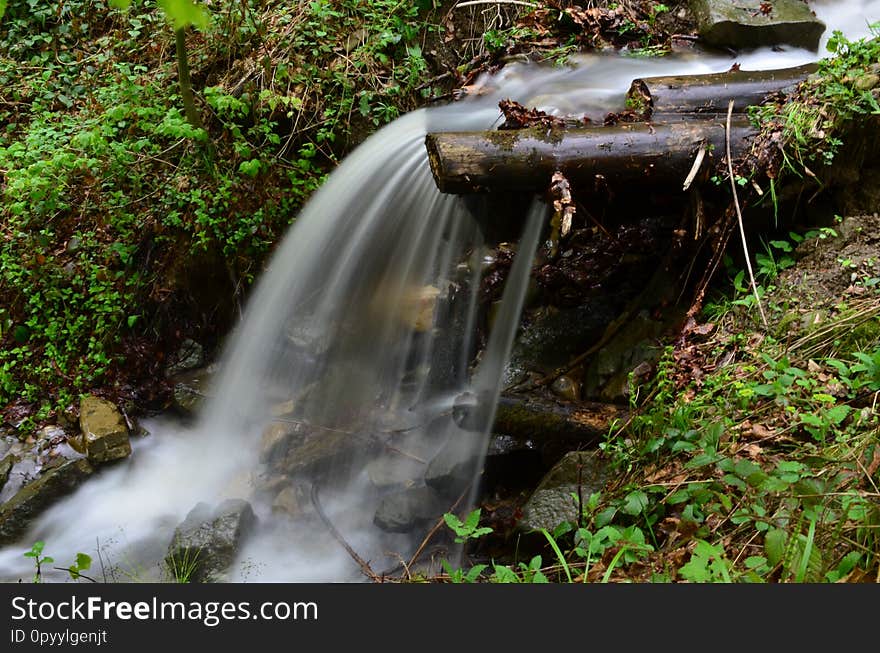 Beautiful waterfall with clear water on a mountain stream in the forest