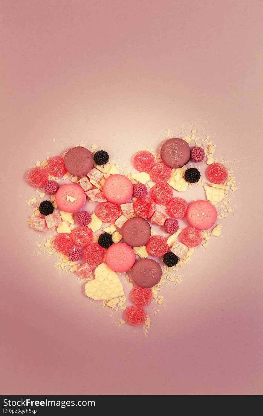 Heart Of Sweets On A Pink Background