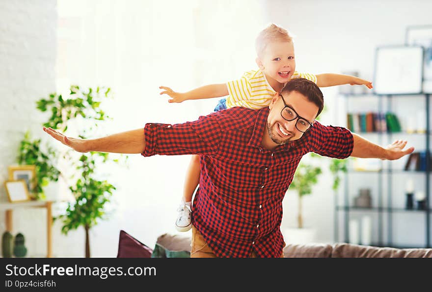 Father`s day. Happy family son hugs his dad