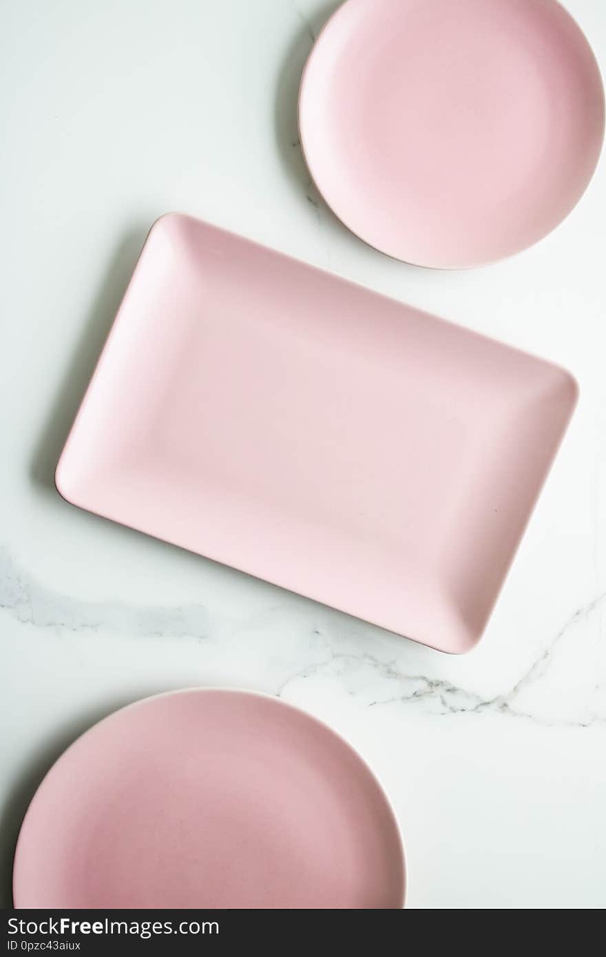 Pink empty plate on marble, flatlay - stylish tableware, table decor and food menu concept. Serve the perfect dish. Pink empty plate on marble, flatlay - stylish tableware, table decor and food menu concept. Serve the perfect dish