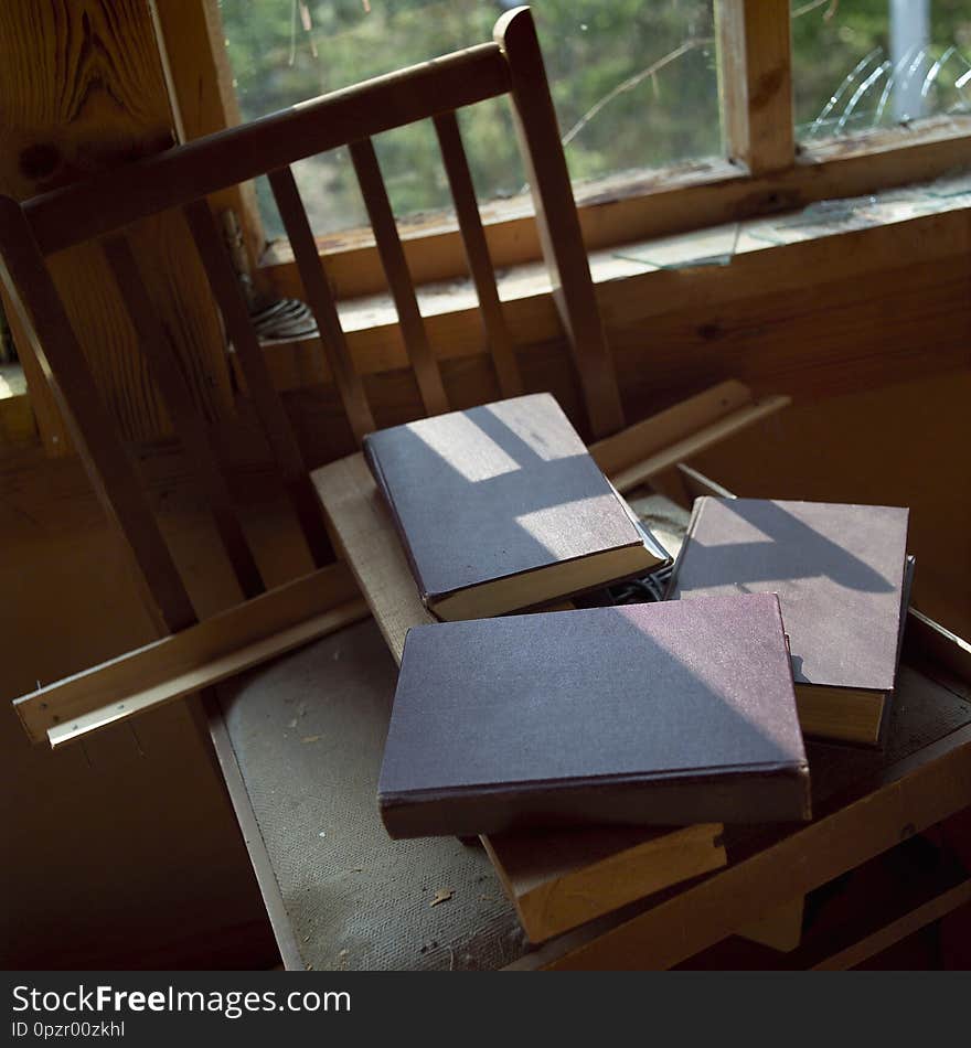 Books covered with dust in a seemingly abandoned house