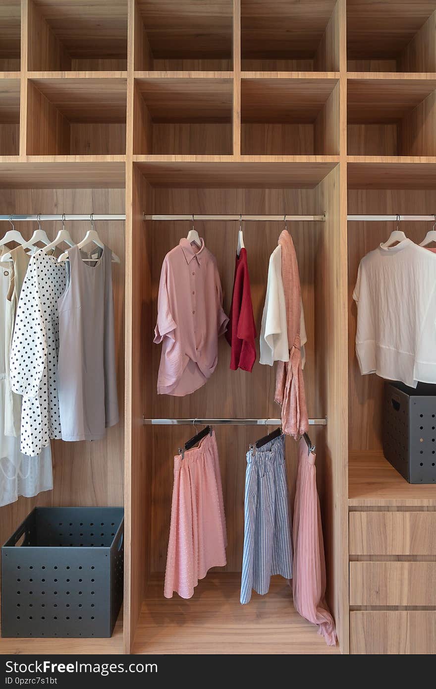 modern closet with clothes hanging