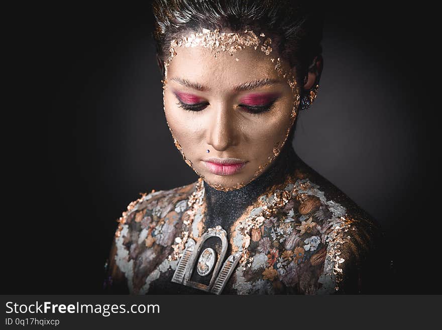 Portrait a girl with Golden icon painting makeup