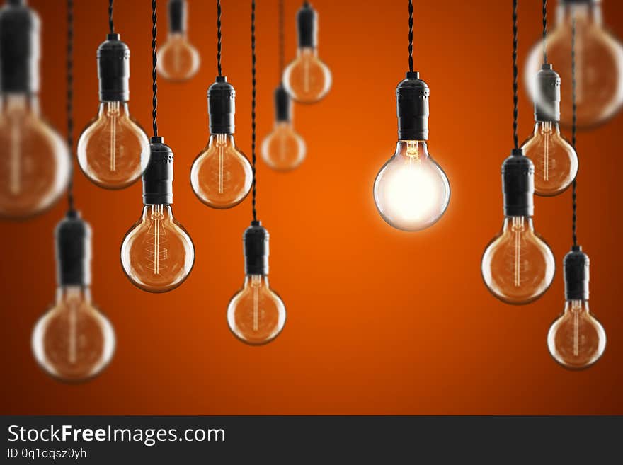 Idea and leadership concept Vintage incandescent Edison type bulbs on color wall background bright conceptual creative creativity design electric electricity energy equipment glass glow glowing illumination innovation lamp light lightbulb object old power science symbol technology transparent yellow business concepts success blue. Idea and leadership concept Vintage incandescent Edison type bulbs on color wall background bright conceptual creative creativity design electric electricity energy equipment glass glow glowing illumination innovation lamp light lightbulb object old power science symbol technology transparent yellow business concepts success blue