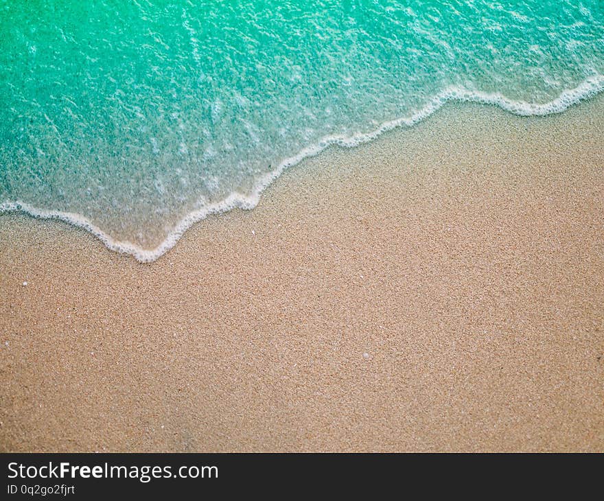 Soft wave on sandy beach. Background summer concept background