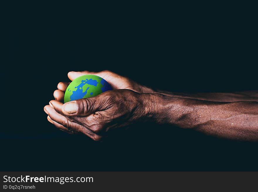Old men hand holding the earth, environment concept, save the earth concept, climate change. Old men hand holding the earth, environment concept, save the earth concept, climate change