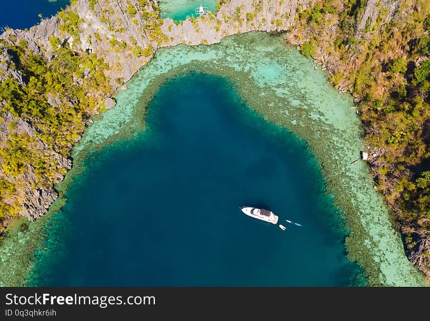 Lagoon with turquoise water surrounded by cliffs.Seascape in the Philippines aerial view. Philippines, Palawan. Lagoon with turquoise water surrounded by cliffs.Seascape in the Philippines aerial view. Philippines, Palawan