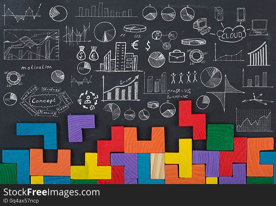 Business concept - jigsaw, sketch with schemes and graphs on chalkboard. Business concept - jigsaw, sketch with schemes and graphs on chalkboard